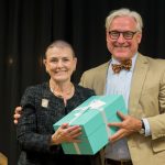 Carla Alexander '68 accepts her Alumnae Achievement Award from President Bradley W. Bateman.