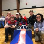 (Left to right) Jessica Gross '21, Brendan Wicker '21, Brendan Kaiser '21, Charli, Peter Sheldon, physics professor, and Joe Vazquez '19