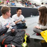 The annual Science Festival is one of the Randolph Society of Physics Students' biggest events. Here, a Randolph student shows children how to create a circuit.