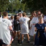 Students converse and take photos in the parking lot of the Maier Museum of Art at Randolph College after the Torch Relay.