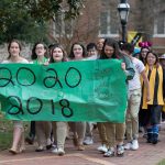 Sophomores carry the banner and lead the procession to the Sundial