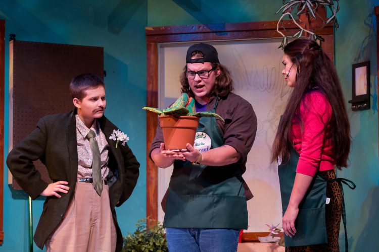 The man-eating plant talks to actors in Little Shop of Horrors The man-eating plant talks to actors in Little Shop of Horrors