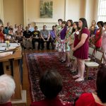 Phi Beta Kappa inductees stand as they are recognized as Phi Beta Kappa inductees