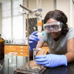 Valarie Osei-Akyeampong ’19 works to extract pigment from a sample of rice