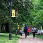 Students walking along the brick path on front campus