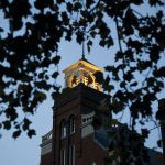 Main Hall tower lit up at dusk