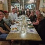 Music professor Randall Speer, Randolph students, and other academy attendees have dinner