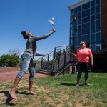 Taylor Samuels ’18 (left) and Stacey Samuels ’18 play badminton during Macon Activities Council's Outdoor Fest in April.