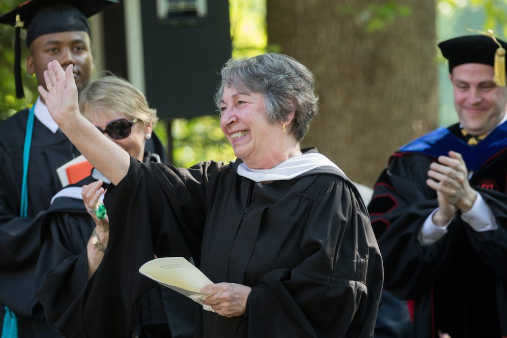 Paula Wallace, associate dean of the College, waves to the crowd at the 2018 Commencement ceremony.