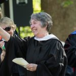 Paula Wallace, associate dean of the College, waves to the crowd at the 2018 Commencement ceremony.