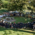 Seniors and sophomores sing traditional songs around the Sundial