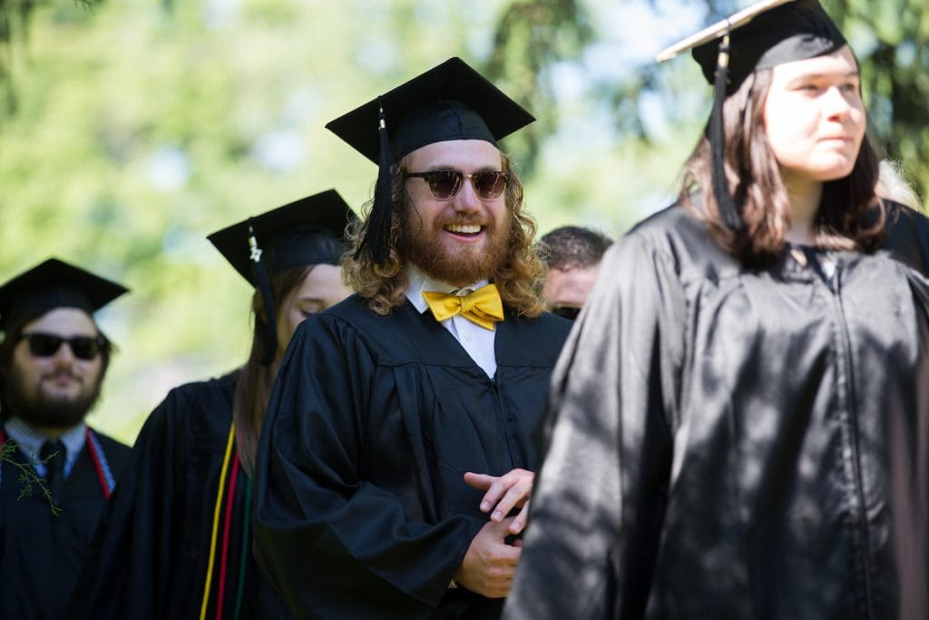 Students in cap and gowns for graduation