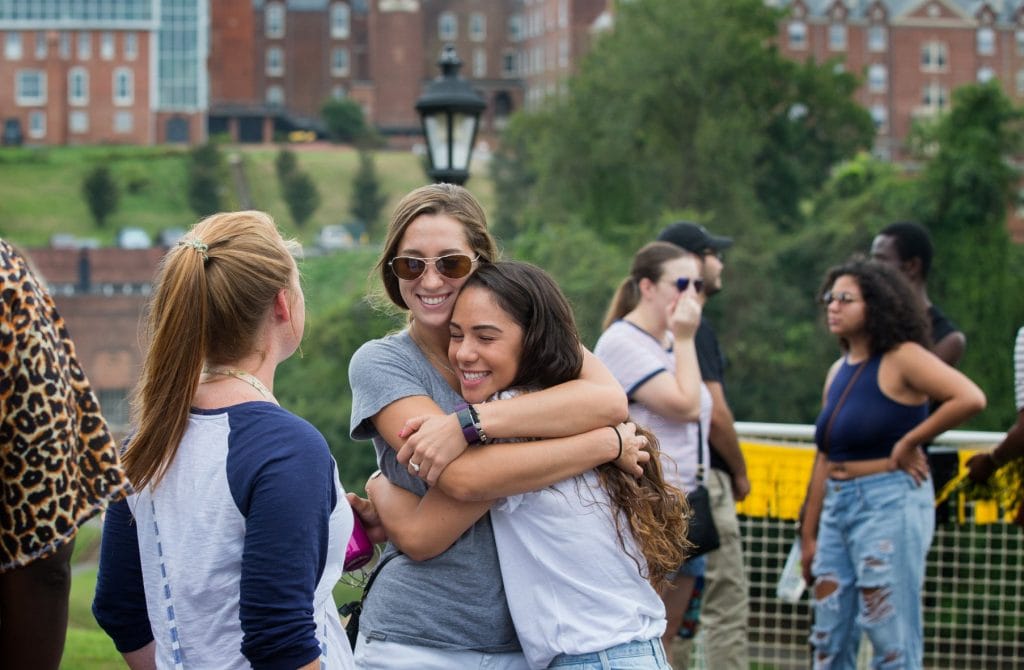 Alumnae embrace at Homecoming