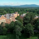 Aerial photo of campus, with the mountains in the background