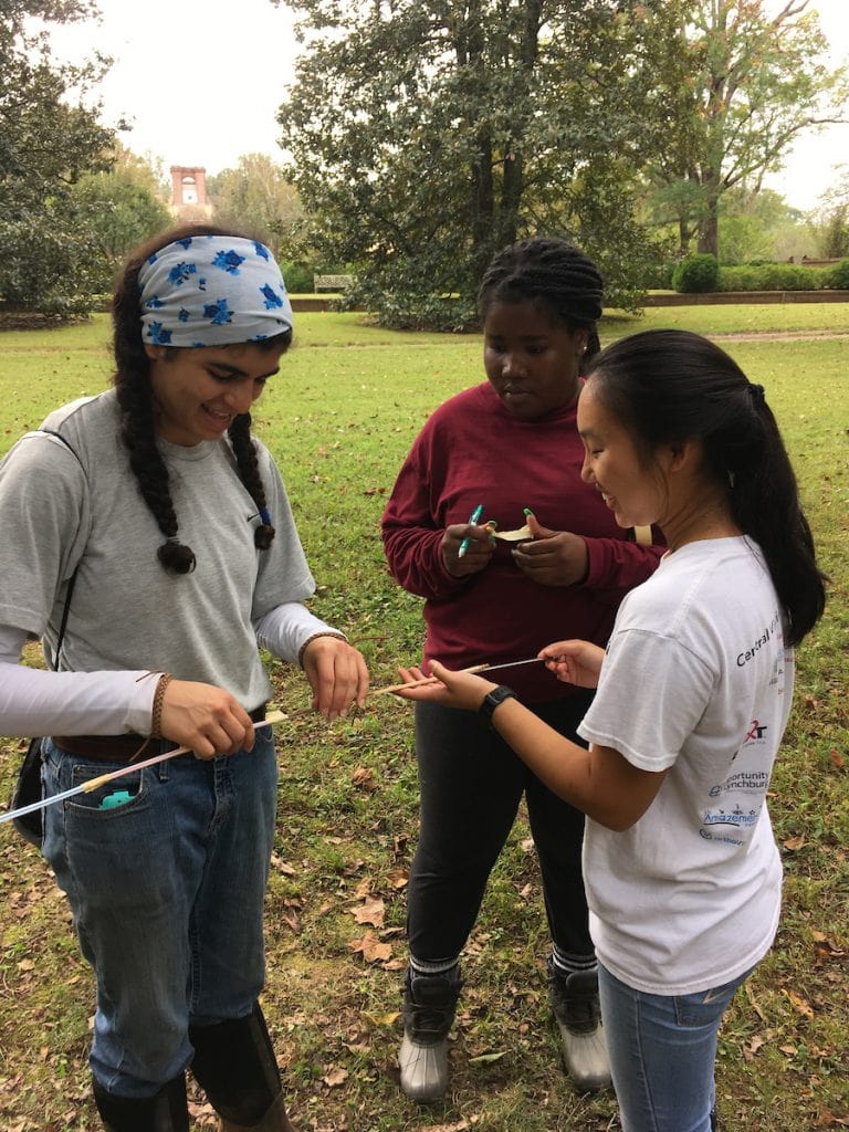 Students examine tree core samples