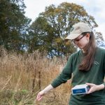 Andrea Wilson '20 plants seeds for milkweed—a required food source for Monarch butterflies in their larval stage.