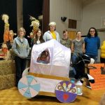 Randolph students pose with Maddie, age 6, in her Cinderella-themed costume, 