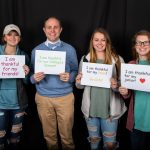 Wes Fugate, vice president for student affairs, and Randolph students express their gratitude at the Giving Tuesday photo booth