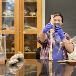 Rachel Harrison '18 takes a photo of fossils during a museum and heritage studies course