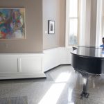 George Darko-Boateng '20 plays the piano in Main Hall lobby