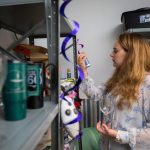 Kayla Henniger ’19 examines crafting supplies while “shopping” in the Rummage Room.