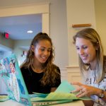 Maegan Crews Fallen (right) works with a student during a resume revamp session