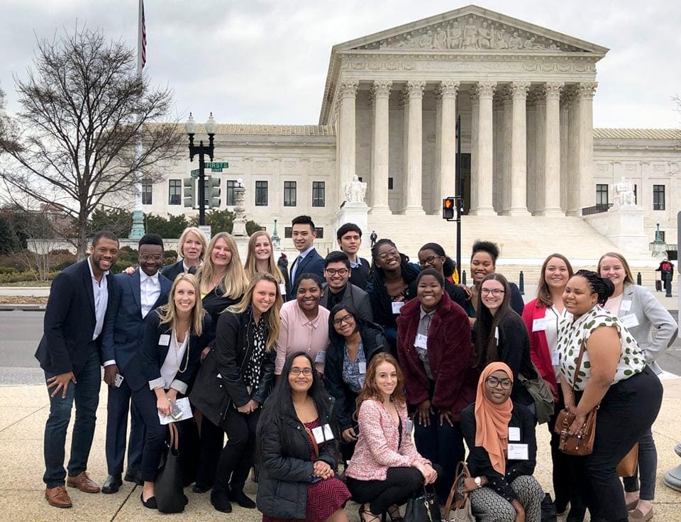 Randolph students with Rashan Colbert '11 in front of the Supreme Court building in Washington, D.C.