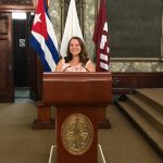 Lauren Appel '20 at the podium in a Cuban government building Lauren Appel '20 at the podium in a Cuban government building