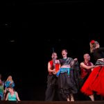 Faculty members perform a belly dancing routine