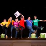 Faculty and staff have fun with the alphabet in a singing and dancing routine