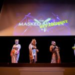 Masked faculty members perform in "The Masked Department" skit (spoiler alert: it was the education department)