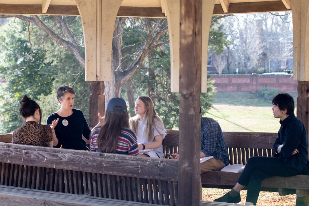 Professor Kaija Mortensen teaches class in the gazebo on front campus