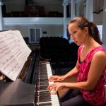 Emily Chua playing piano in Wimberly Recital Hall at Randolph