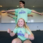 Students in line making poses at Embark Theatre Camp