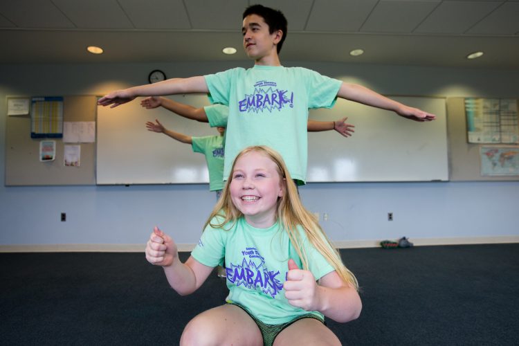 Students in line making poses at Embark Theatre Camp Students in line making poses at Embark Theatre Camp