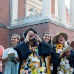 Seniors will wear their graduation robes (decked out in buttons) and funny hats to the ceremony