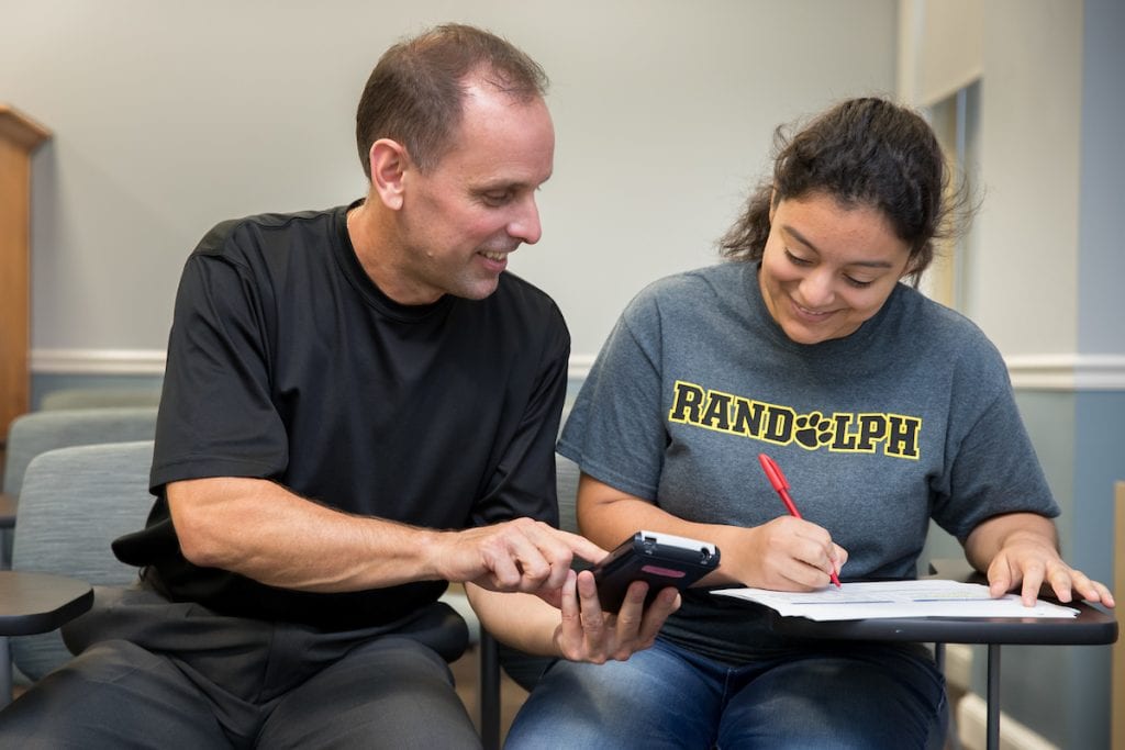 Professor Jeff Heinfeldt works with a student