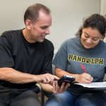 Professor Jeff Heinfeldt works with a student