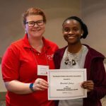 Ke’Asia Carter ’19 M.A.T. (right) accepts the Highest Membership Increase award from SVEA President Catie Travassos.