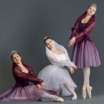 Three dancers posing for a photo