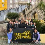 Students hold the Randolph WildCats banner in Sintra