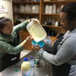Maya Wheeler and Tyrah Cobb-Davis work at a food bank in the village of Estrela