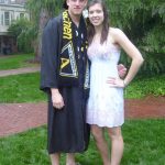 Aaron in his senior robes and Megan as a sophomore, wearing white for Daisy Chain
