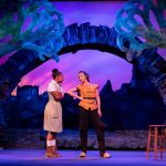Two actresses interact in the play