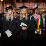 Graduates look towards the stage