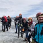 Students in hiking gear on top of a glacier