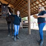 Sidney Clark and biology professor Amanda Rumore examine one of their test subjects