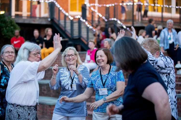 A group of alumnae dance in Michels Plaza A group of alumnae dance in Michels Plaza