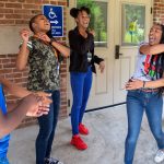 Freedom School students interact with one of their mentors outside Smith Memorial Building