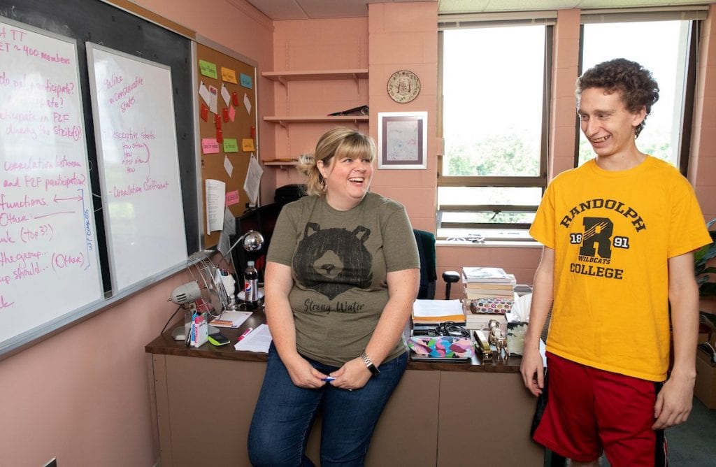 Professor Crystal Howell and Caleb Schmitzer go over their notes about the project